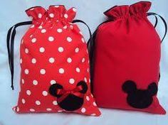 two red bags with white polka dots and mickey mouse ears on them, one has a black bow