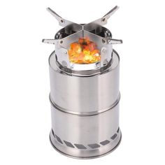 a stove that is sitting on top of some kind of metal container with flames in it