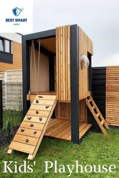 a small wooden structure with steps leading up to the top and bottom floor, in front of a fenced yard