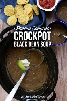 an overhead view of crockpot black bean soup with tortilla chips on the side