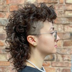 30 Statement-Making Mullet Haircuts for Women to Define Your Style Curly Hair Short Styles Women, Medium Curly Mullet, Modern Perm Short Hair, Womens Mullet Shaved Sides, Women Mullet Shaved Sides, Short Curly Mullet Shaved Sides, Womens Short Curly Hair, Curly Mullet With Undercut, Mullet Curly Hairstyle Women