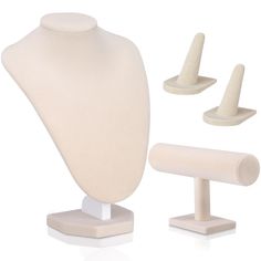 a white mannequin with three different sized pieces on each side and one standing upright