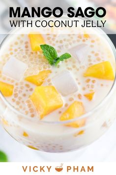 mango sago with coconut jelly in a glass topped with ice and mint garnish