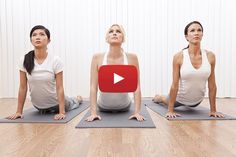 three women are sitting on yoga mats in a row and one is looking up at the sky