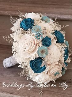 a bridal bouquet with blue and white flowers