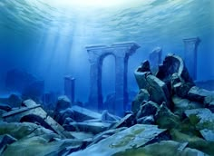 an underwater view of some rocks and pillars