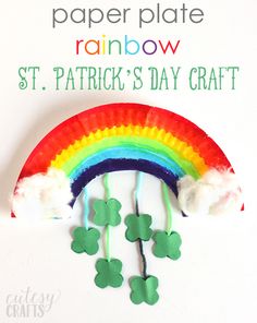 paper plate rainbow st patrick's day craft with shamrocks on it and a white background