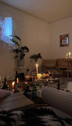 a living room filled with furniture and candles