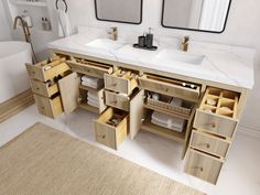 a bathroom with two sinks and drawers in it