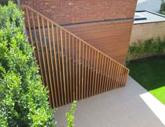 a wooden staircase next to a brick building