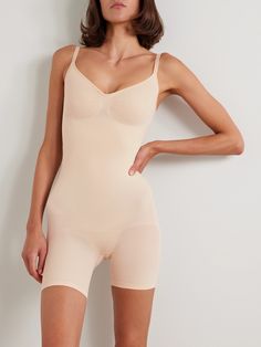 SKIMS' 'Seamless Sculpt' collection is designed to smooth and define the figure. Made from high-compression stretch fabric, this bodysuit has mid-length shorts and a scooped back, so you can wear it under low-cut dresses or tops. Compressive Elastane Shapewear With Lined Body, Seamless Shaping Shapewear For Sports, Sports Shaping Seamless Shapewear, Sports Seamless Shaping Shapewear, Compressive Lined Shapewear, Fitted Seamless Shapewear Bodysuit, Compressive Elastane Shapewear For Sports, Fitted Smoothing Shapewear For Sports, Stretch Seamless Shapewear Bodysuit