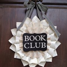 a book club wreath hanging on the front door