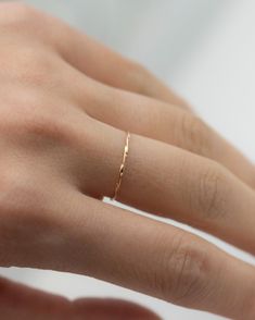 Modern and timeless twisted wire ring. Twisted Stacker Gold Ring It's a simple and dainty everyday jewelry that adds a tiny sparkle to your finger :)  Perfect as a stacking ring or by itself. * 14k gold * Ring measures about 1.1mm Dainty Gold Ring, Ring Everyday, Dainty Gold Rings, Wire Ring, Twisted Wire, Wire Rings, Finger Rings, Ring Dainty, 14k Gold Ring