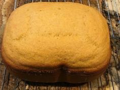 a loaf of bread sitting on top of a cooling rack