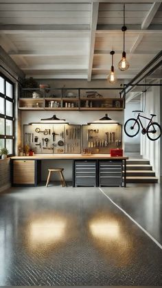 an industrial garage with lots of storage space and lights hanging from the ceiling above it