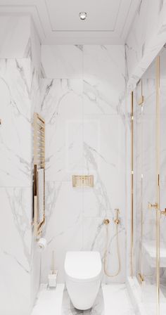 a white bathroom with gold accents and marble walls