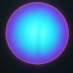 an image of a blue ball in the dark