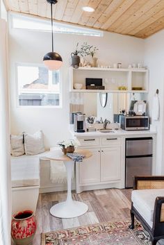 the kitchen is clean and ready to be used as a living room or dining area