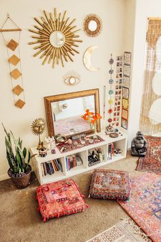 a living room filled with lots of furniture and decor on top of carpeted flooring