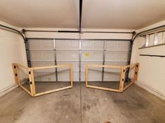 an empty garage with two mirrors in it