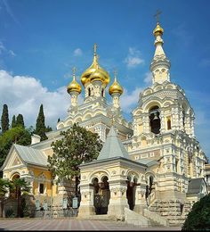 an ornate building with gold domes on it