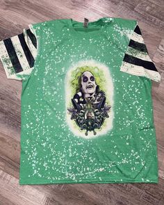 Bleached Beetlejuice Beetlejuice Beetlejuice front and back shirt. Beetle Juice Shirts, Beetlejuice Shirt Ideas, Casual Green Halloween Top, Cotton Tops With Character Print For Alternative Fashion, Fitted Short Sleeve Themed Tops, Casual Acid Wash Tops For Halloween, Themed Green Crew Neck Top, Green Themed Crew Neck Top, Halloween Acid Wash Skull Print Top