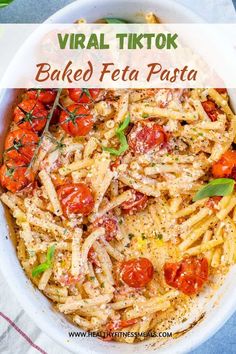 a white bowl filled with pasta and tomatoes