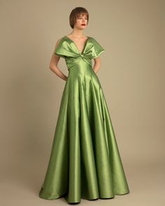 This Gemy Maalouf long dress is perfect for gala evenings. Made with fantastic fabric and expert design details, it provides a bow-like princess cut that flatters every figure. Look and feel like royalty at your next event with this stunning gown. Bow-like design upper part in a princess cut green long dress comes in a mikado seta laminated fabric. Gemy Maalouf fits small. We recommend sizing up. Dress Length from waist to hemline: 120cm SKU: GMW23 6763LD Mikado Fabric Dress, Long Green Dress, Laminated Fabric, Stunning Gowns, Princess Cut, Black Tie, Evening Wear, Green Dress, Dress Length