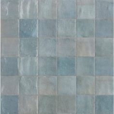 an image of a tile wall that looks like it has been painted blue