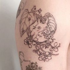 a woman's thigh with tattoos on it