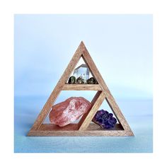 Triangle crystal shelf display or meditation altar.  Choice of colour and size. Please refer to the photos and make your choice during checkout. Sizes available -  23cm x 20cm x 4cm  28cm x 25cm x 4cm  28cm x 25cm x 6cm Gift packs available -  23cm x 20cm x 4cm Wooden Shelf + 10 Crystal Lucky Dip 28cm x 25cm x 4cm Wooden Shelf + 10 Crystal Lucky Dip Great gift!  Place anywhere in your home to energise the space. Great for crystals, knick knacks, small essential oils, herbs or any type of ornament or plant.  This listing is for the described items only. The crystals in the pictures are not included unless stated in the description above.  All shelves are handmade and painted. Crystal Shelf Display, Tool Display, Crystal Shelf, Witch Tools, Crystal Altar, Crystal Shelves, Meditation Altar, Zen Space, Pagan Witch