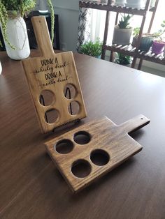 a wooden object with holes in it sitting on a table