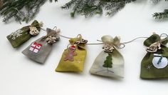 four small bags with christmas decorations on them