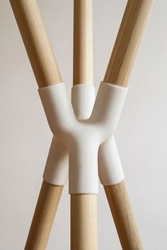 three wooden sticks sticking out of the top of a table