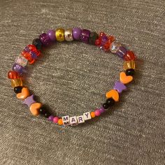 Mary The Middle Sibling Of The Sanderson Sisters Middle Sibling, The Sanderson Sisters, Sanderson Sisters, Hocus Pocus, Handmade Bracelet, Purple Orange, Orange And Purple, Jewelry Ideas, Handmade Bracelets