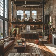 a living room filled with furniture and lots of windows