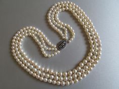 Graduated triple strand cultured saltwater pearl necklace, with diamond clasp in 18K yellow gold and silver. With a Swedish hallmark H8 or H9 (1934 or 1958). JP 1913 1973 Petterssons Eftr Juvelerar Cultured Saltwater Pearl Diameter: in the range from 5.5 mm to 8.7 mm Bodycolour: Light Cream Overtone: Cream Luster: Good / Very Good Shape: Round / Semi Baroque Surface: Slightly Blemished Additional Stones: Natural Diamond: 23 pcs. cca. 0.7 ct Rose Cut - I/J -VS/SI/P1 Inner Row Length: 54 cm Total Saltwater Pearl Necklace, Pearl Necklace Vintage, Saltwater Pearls, Diamond Chain, Vintage Pearls, Dainty Jewelry, Turquoise Earrings, Rose Cut, Chain Styles