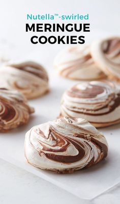 cookies with white frosting and chocolate swirled on top