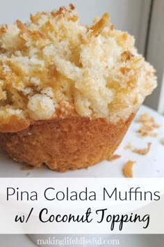 pina colada muffins with coconut topping on a white plate next to a window