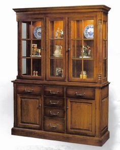 a wooden china cabinet with glass doors and drawers