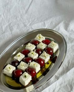 a plate filled with food on top of a white table cloth