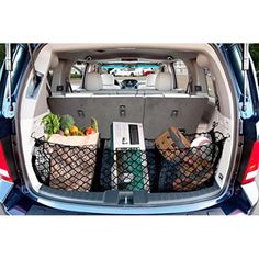 the back end of a car with several baskets in it's trunk and cargo compartment