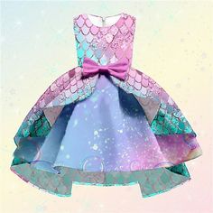 a dress made out of paper with a pink bow on the front and blue, purple, and green colors