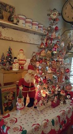 a christmas tree with santa claus and other ornaments