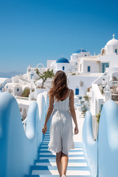 a woman walking down a blue and white walkway