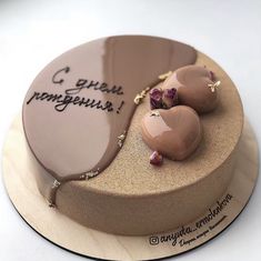 there is a cake decorated with chocolates and writing on the top, along with other decorations