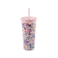 a pink tumbler cup with floral designs and a straw in the middle, on a white background