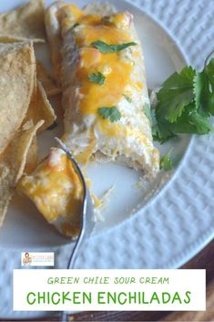 green chile soup cream chicken enchiladas on a plate with tortilla chips