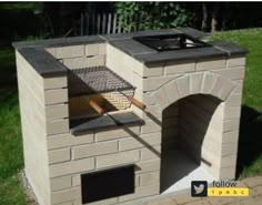 an outdoor brick oven with a grill on top