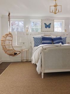 a bedroom with white walls and blue accents